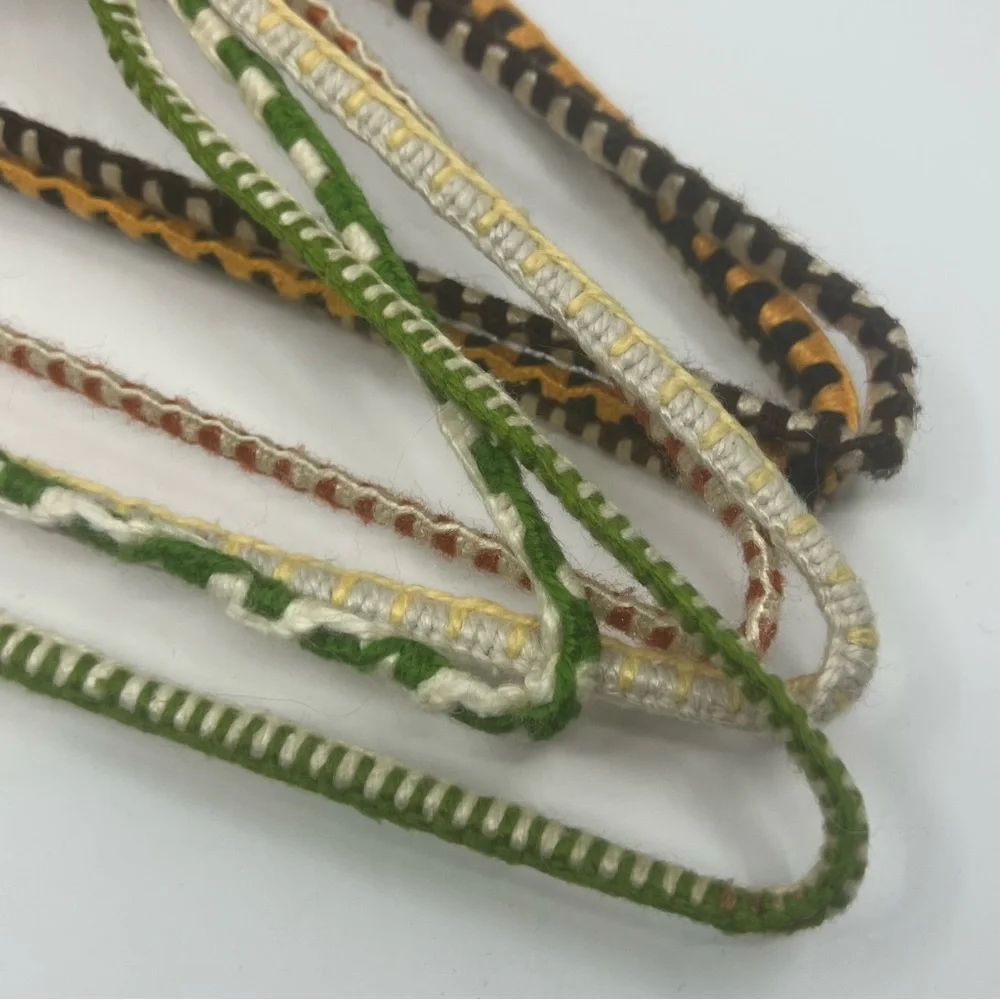 7 vintage wire hangers wrapped in yarn multi color as is